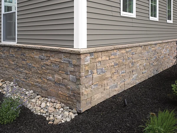 Home with stone siding on its bottom half