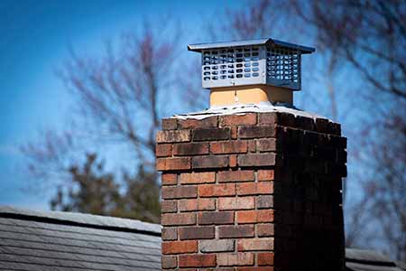 brick chimney with metal chimney cap